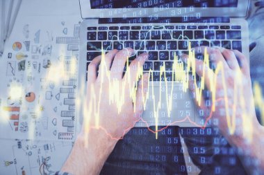 Dizüstü bilgisayar klavyesini ve ön x çizim hologramını yazarken çift pozlama. Üst Manzara. Finans piyasası kavramı.