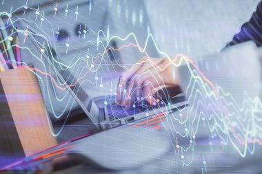 Bilgisayarda ve ön x grafik hologram çiziminde kadın eli yazarken çift pozlama. Borsa yatırım kavramı.