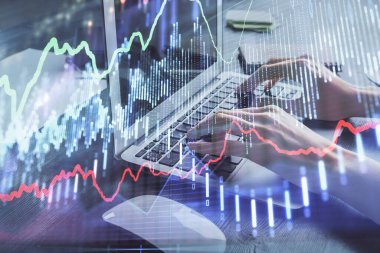 Bilgisayarda ve ön x grafik hologram çiziminde kadın eli yazarken çift pozlama. Borsa yatırım kavramı.