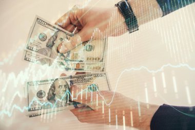 Finansal grafiğe çoklu pozlama hologram, Amerikan dolarları ve insan eli. Analiz kavramı.
