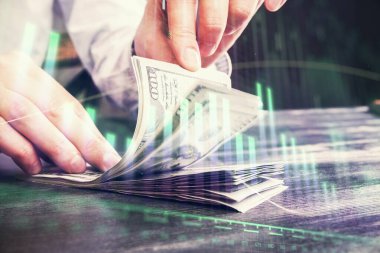 Forx grafiği, hologram, Amerikan dolarları ve insan eli çizimleri. Teknik Analiz kavramı.