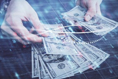 Finansal grafiğe çoklu pozlama hologram, Amerikan dolarları ve insan eli. Analiz kavramı.