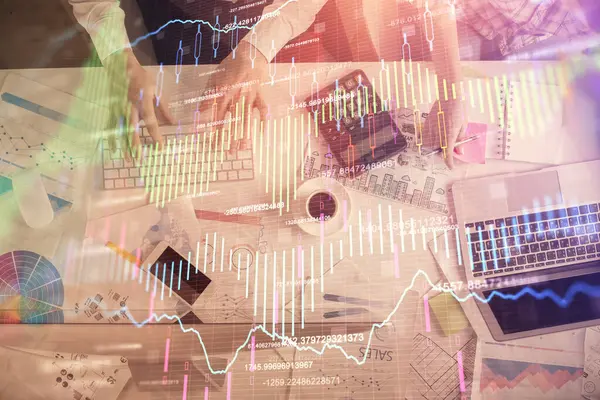 Double exposure of man and woman working together and financial chart hologram drawing. market analysis concept. Computer background. Top View. — Stock Photo, Image