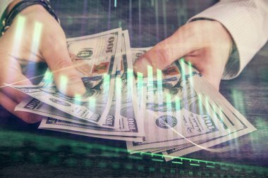 Finansal grafiğe çoklu pozlama hologram, Amerikan dolarları ve insan eli. Analiz kavramı.