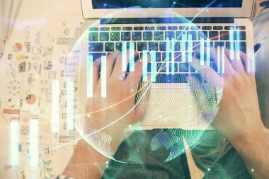 Dizüstü bilgisayar klavyesini ve ön x çizim hologramını yazarken çift pozlama. Üst Manzara. Finans piyasası kavramı.