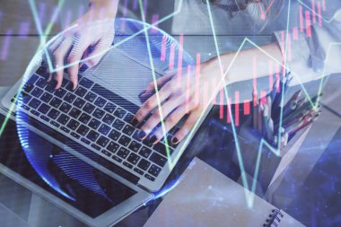 Bilgisayarda ve ön x grafik hologram çiziminde kadın eli yazarken çift pozlama. Borsa yatırım kavramı.