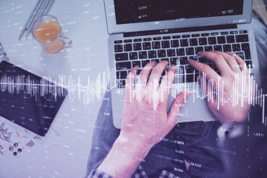 Dizüstü bilgisayar klavyesini ve ön x çizim hologramını yazarken çift pozlama. Üst Manzara. Finans piyasası kavramı.