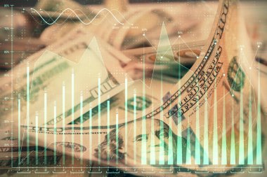 Önx grafiğinin arka plandaki dolarları iki katına çıkarması. Finans piyasası kavramı.