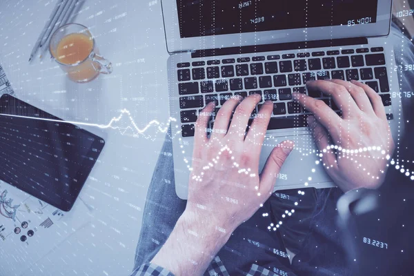 Double exposure of mans hands typing over laptop keyboard and forex chart hologram drawing. Top view. Financial markets concept. — Stock Photo, Image