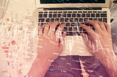 Dizüstü bilgisayar klavyesini ve ön x çizim hologramını yazarken çift pozlama. Üst Manzara. Finans piyasası kavramı.