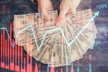 Finansal grafiğe çoklu pozlama hologram, Amerikan dolarları ve insan eli. Analiz kavramı.
