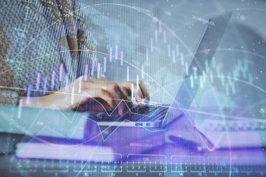 Bilgisayarda ve ön x grafik hologram çiziminde kadın eli yazarken çift pozlama. Borsa analizi kavramı.