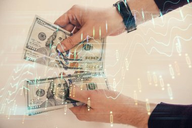 Finansal grafiğe çoklu pozlama hologram, Amerikan dolarları ve insan eli. Analiz kavramı.