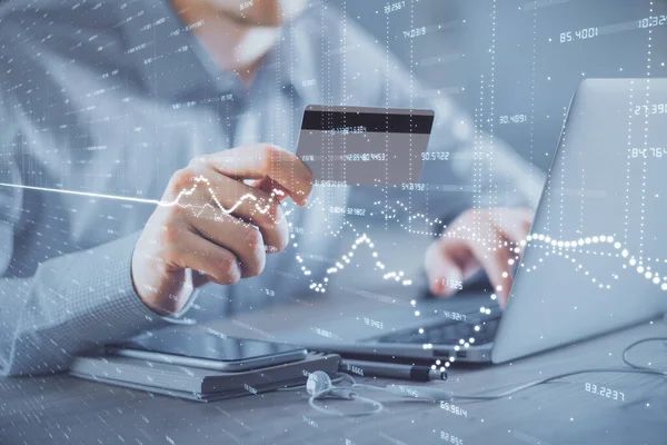 Double exposure of man hands holding a credit card and Forex graph drawing. Stock trading and digital fintech in Internet E-commerce concept. — Stock Photo, Image