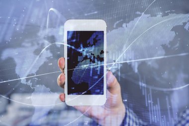 Erkeklerin el ele tutuşup dijital bir cihaz ve ön grafik çizimi kullanırken çift pozlama. Finansal piyasa kavramı.