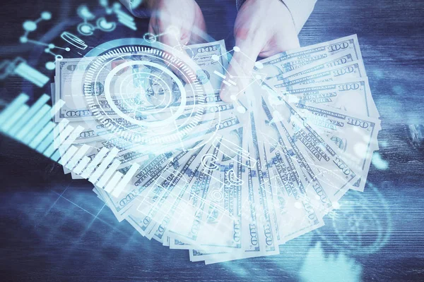 Multi exposición de tema financiero dibujo holograma y EE.UU. billetes de dólares y las manos del hombre. Concepto empresarial. — Foto de Stock