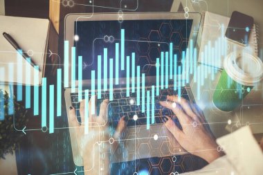 Bilgisayarda ve ön x grafik hologram çiziminde kadın eli yazarken çift pozlama. Borsa yatırım kavramı.