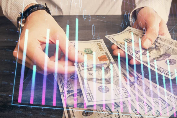 Multi blootstelling van de financiële grafiek tekenen hologram en Amerikaanse dollars rekeningen en man handen. Analyse concept. — Stockfoto