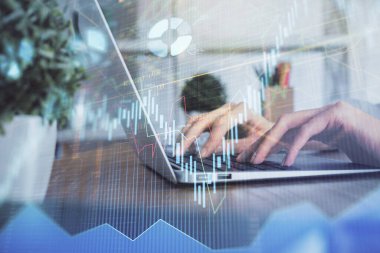 Bilgisayarda ve ön x grafik hologram çiziminde kadın eli yazarken çift pozlama. Borsa yatırım kavramı.