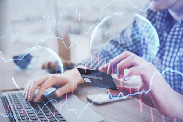 Double exposure of man hands holding a credit card and Forex graph drawing. Stock trading and digital fintech in Internet E-commerce concept. — Stock Photo, Image