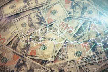 Forx grafiğinin çok sayıda görüntüsü bize dolar banknotları arka planında görünüyor. Finansal başarı piyasası kavramı.