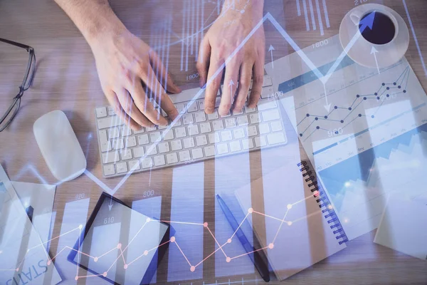 Multi exposure of mans hands typing over computer keyboard and forex graph hologram drawing. Top view. Financial markets concept. — Stock Photo, Image