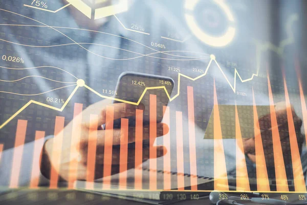 Double exposure of mans hands holding and using a phone and financial graph drawing. Analysis concept. — Stock Photo, Image