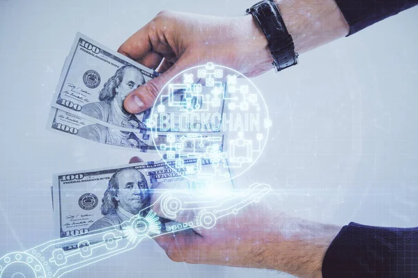 Multi exposición de blockchain tema dibujo holograma y EE.UU. billetes de dólares y las manos del hombre. Concepto empresarial. —  Fotos de Stock