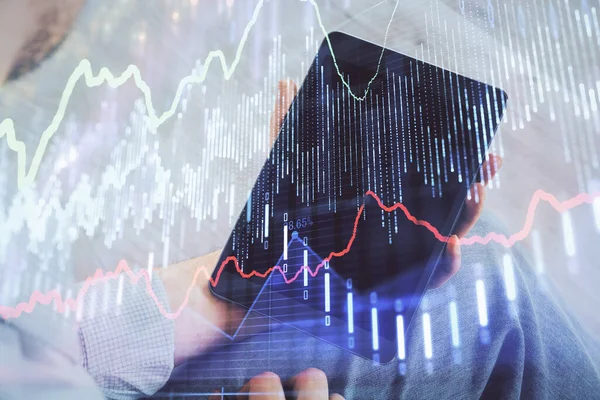 Double exposure of mans hands holding and using a digital device and forex graph drawing. Financial market concept. — Stock Photo, Image