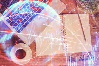 Finans piyasası grafiği ve masaüstü bilgisayarının üst görüntüsü. Çifte maruziyet. Yatırım kavramı.