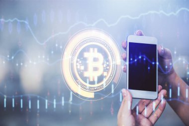 Hologram ve cep telefonu kullanan bir kadın tarafından iki kez görüntülenir..