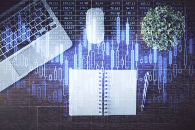 Borsa grafiği ve masa arkasındaki en üst görünüm bilgisayarı. Çifte maruziyet. Finansal eğitim kavramı.