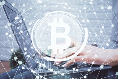 Bilgisayarda ve kripto piyasa temalı hologram çizimlerinde kadın elinin çifte pozu. Engelleme zinciri kavramı.