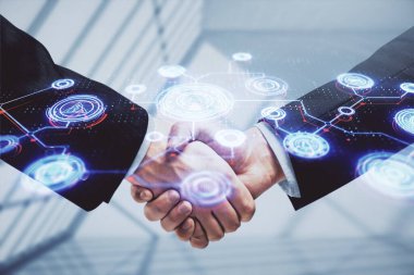 İki kişinin sosyal ağ temalı hologramı ve el sıkışması.