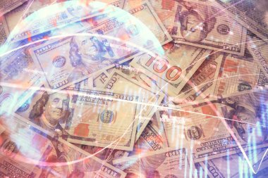 Forx grafiğinin çok sayıda görüntüsü bize dolar banknotları arka planında görünüyor. Finansal başarı piyasası kavramı.