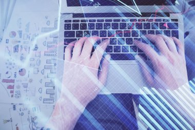 Dizüstü bilgisayar klavyesini ve ön x çizim hologramını yazarken çift pozlama. Üst Manzara. Finans piyasası kavramı.