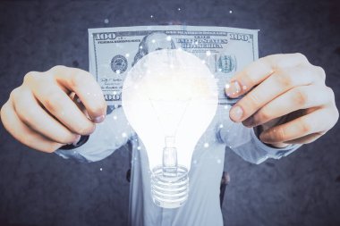 Ampulün hologram çizimi, Amerikan doları banknotları ve insan eli. İş Fikri konsepti.