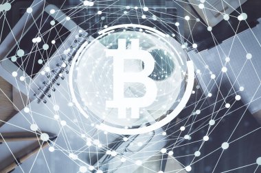 Telefonlu masanın üzerinde iki kat daha fazla engelleme temalı hologram görüntüsü var. Üst Manzara. Kripto teknolojisi kavramı.