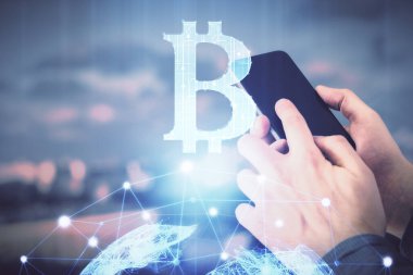 Bir adamın elini tutarken ve telefon ve kripto para birimi engelleme teması kullanırken çift pozlama.