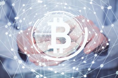 Bir adamın elini tutarken ve telefon ve kripto para birimi engelleme teması kullanırken çift pozlama.