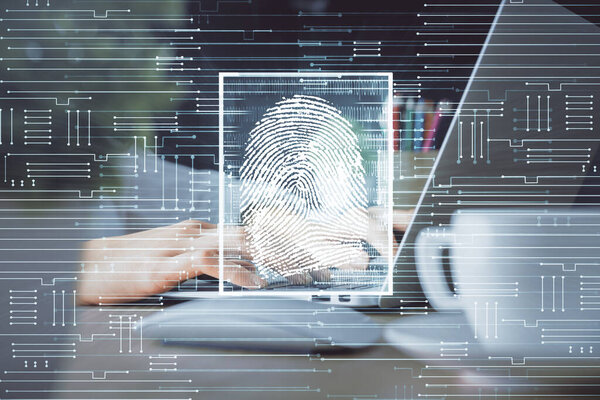 Double exposure of woman hands typing on computer and fingerprint drawing. Security concept.
