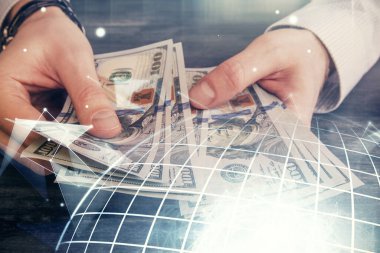 Dünya haritasının iki katına çıkarılması hologram, dolar banknotları ve insan eli..