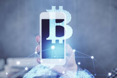 Bir adamın elini tutarken ve telefon ve kripto para birimi engelleme teması kullanırken çift pozlama.