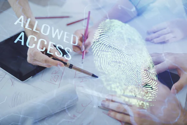 Double exposure of fingerprint hologram and man and woman working together holding and using a mobile device. Security concept