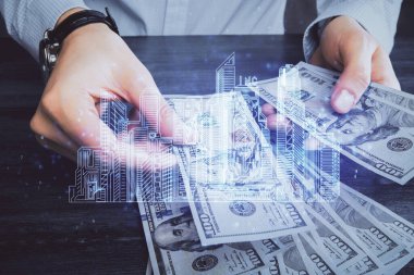 Hologram, Amerikan doları ve insan eli çeken binaların çoklu pozları..