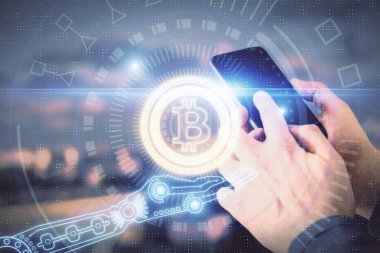 Bir adamın elini tutarken ve telefon ve kripto para birimi engelleme teması kullanırken çift pozlama.