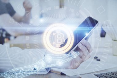 Bir adamın elini tutarken ve telefon ve kripto para birimi engelleme teması kullanırken çift pozlama.