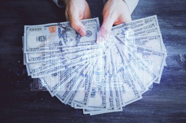 Hologram, Amerikan doları ve insan eli çeken binaların çoklu pozları..