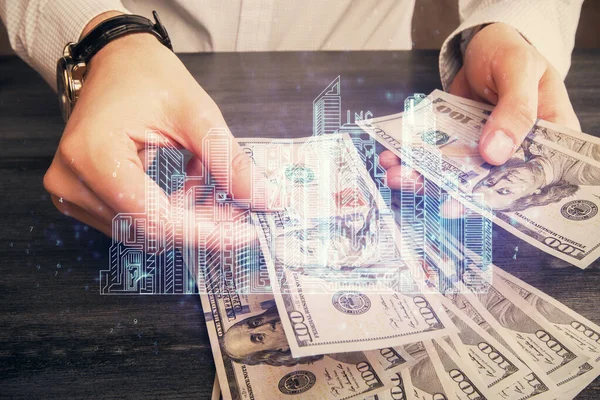 Hologram, Amerikan doları ve insan eli çeken binaların çoklu pozları..