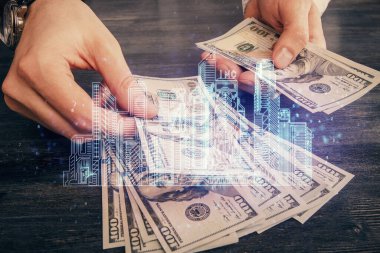 Hologram, Amerikan doları ve insan eli çeken binaların çoklu pozları..